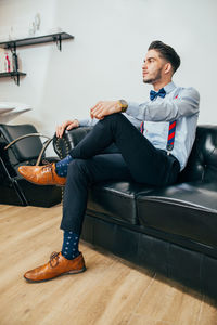 Portrait of a handsome barber in barbershop