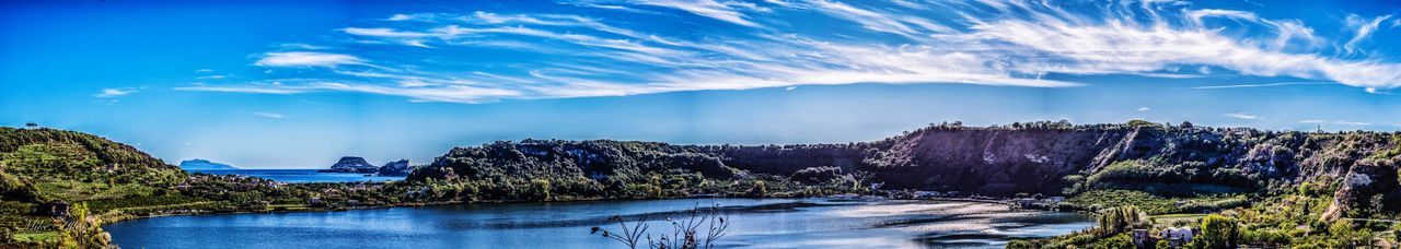 Panoramic view of sea against blue sky