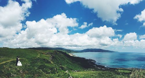 Scenic view of sea against cloudy sky