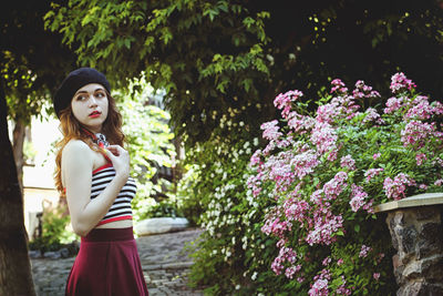 Portrait of young, happy, elegant redhead curly woman, girl in hat, casual clothes. french style. 