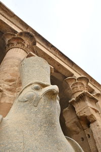 Low angle view of statue against sky