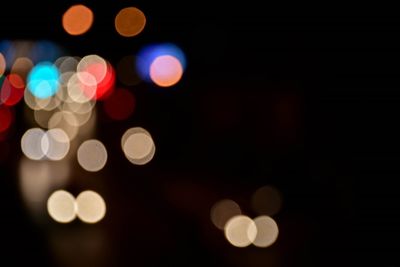 Defocused image of illuminated lights at night