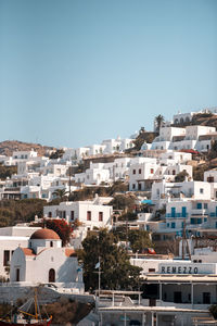 Buildings in city against clear sky greece