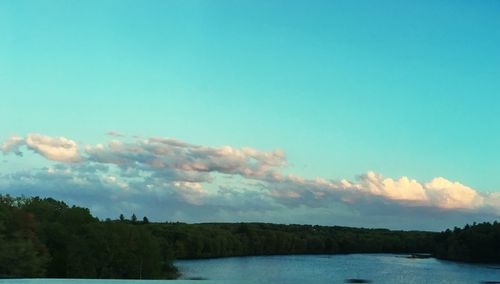 Scenic view of lake against blue sky