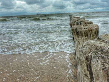 Scenic view of sea against cloudy sky