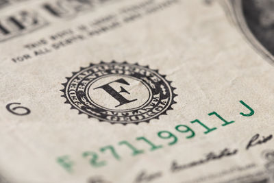 Close-up of bitcoin on paper currency