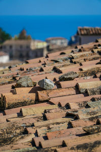 Close-up of rocks on beach against clear blue sky