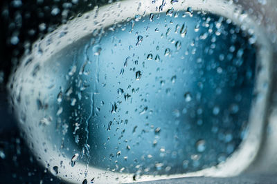 Close-up of raindrops on glass window
