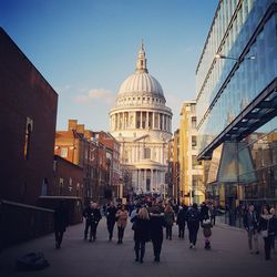 People in city against sky