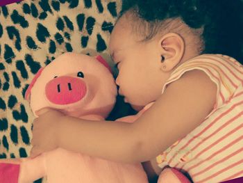 Close-up of cute baby on bed