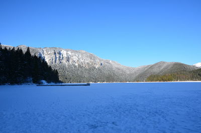 Scenic view of mountains against clear blue sky