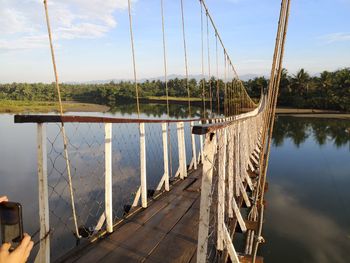 Panoramic view of bridge over lake against sky