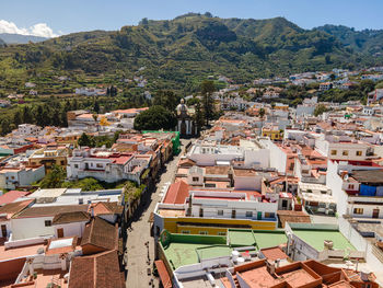 High angle view of townscape and mountains