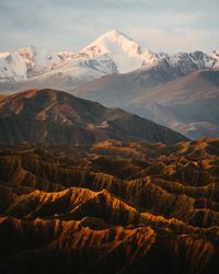 Scenic view of snowcapped mountains against sky