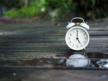 Close-up of alarm clock on table