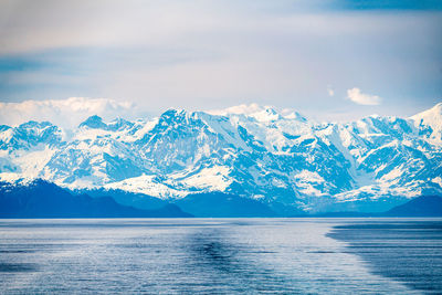 Scenic view of snowcapped mountains against sky