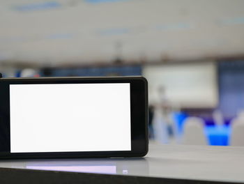 Close-up of mobile phone on table