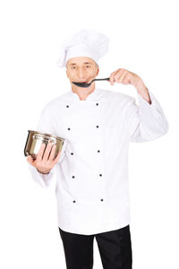 Portrait of man holding ice cream against white background