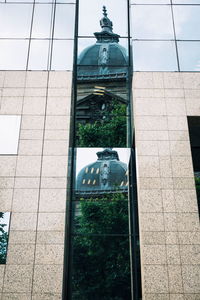 Low angle view of statue against building