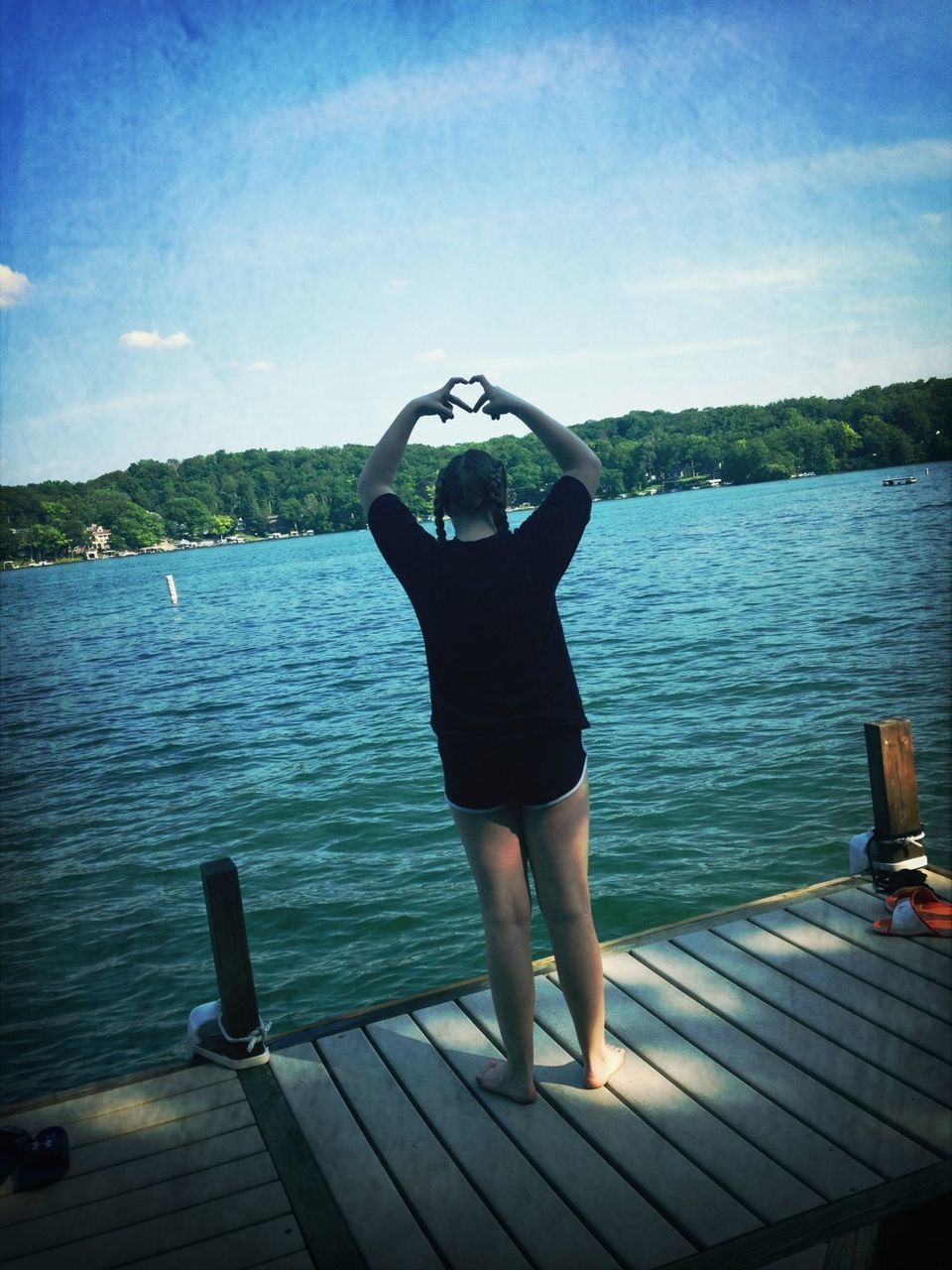 water, lake, sky, lifestyles, leisure activity, rear view, standing, pier, tranquility, tranquil scene, blue, scenics, men, nature, tree, person, beauty in nature, full length