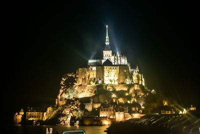 Illuminated buildings in city at night