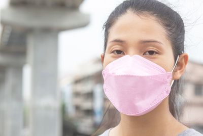 Woman wearing a mask to prevent dust and bacteria