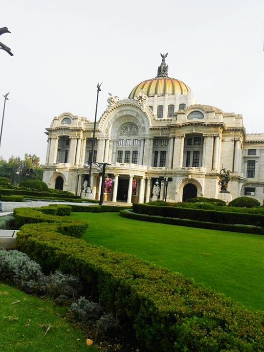 grass, architecture, built structure, building exterior, dome, lawn, clear sky, facade, green color, place of worship, arch, religion, church, history, spirituality, day, outdoors, exterior, travel destinations