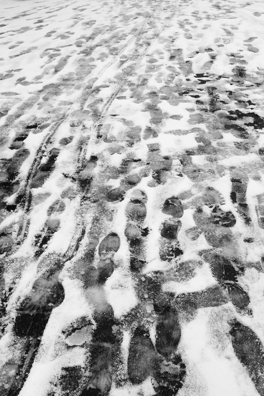 snow, cold temperature, winter, high angle view, full frame, tranquility, backgrounds, footprint, nature, pattern, covering, tranquil scene, season, day, landscape, beauty in nature, outdoors, sand, weather, no people