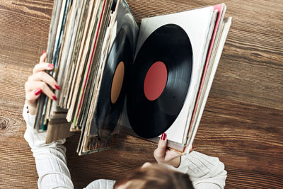 Analog records. listening to music from vinyl record. music passion and hobby. vintage style. search