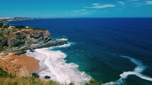 High angle view of sea against blue sky