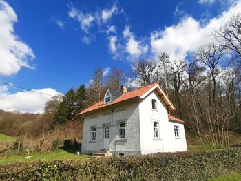 House on field against sky