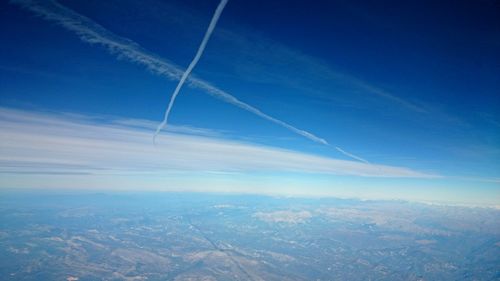 Aerial view of landscape with mountain range in background