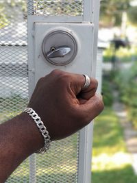 Close-up of hand holding metal