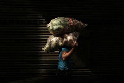 Full length of woman standing on wall