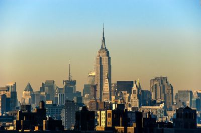 Modern buildings in city against sky