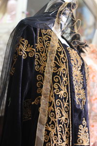 Close-up of clothes hanging on display at store