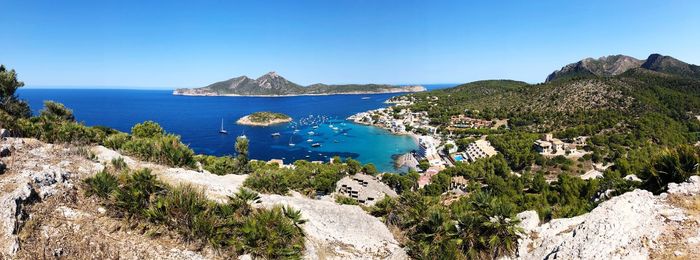 Scenic view of sea against clear blue sky