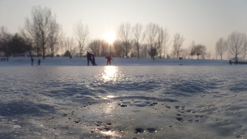 Scenic view of frozen lake against clear sky during winter