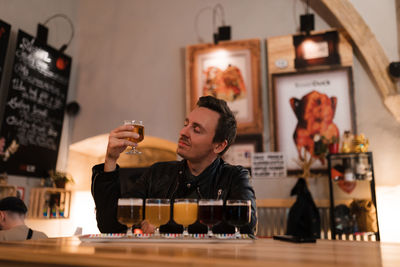 Full length of a man drinking glass