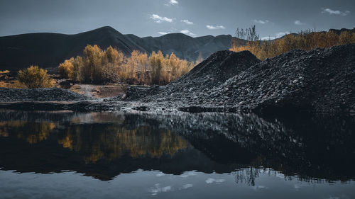 Scenic view of lake against sky during sunset