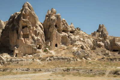 Low angle view of rock formations against sky