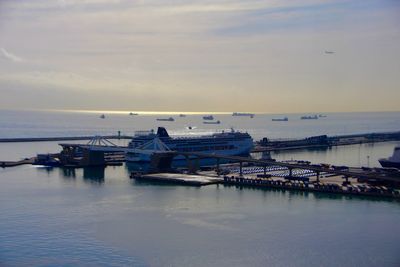 Boats moored in sea against sky