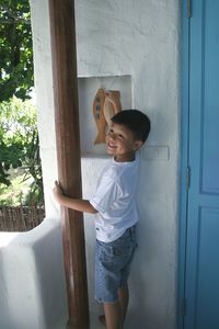 Boy holding toy animal