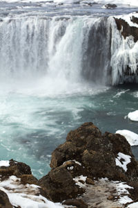 Closeup of frozen waterfall godafoss in iceland, wintertime
