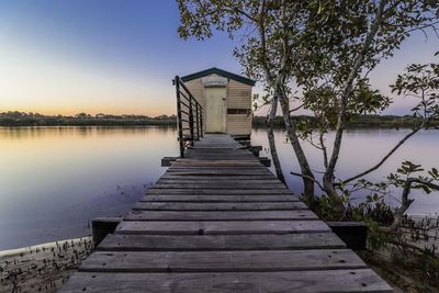 Pier over lake against sky