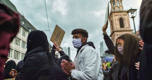 Group of people in front of buildings