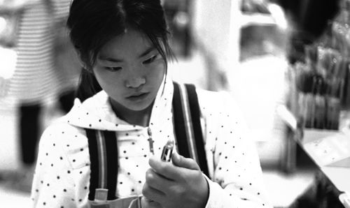 Close-up of young woman holding hands