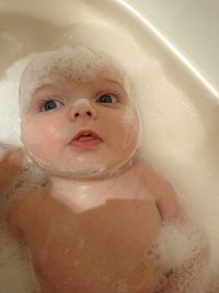 Close-up of baby in bathtub