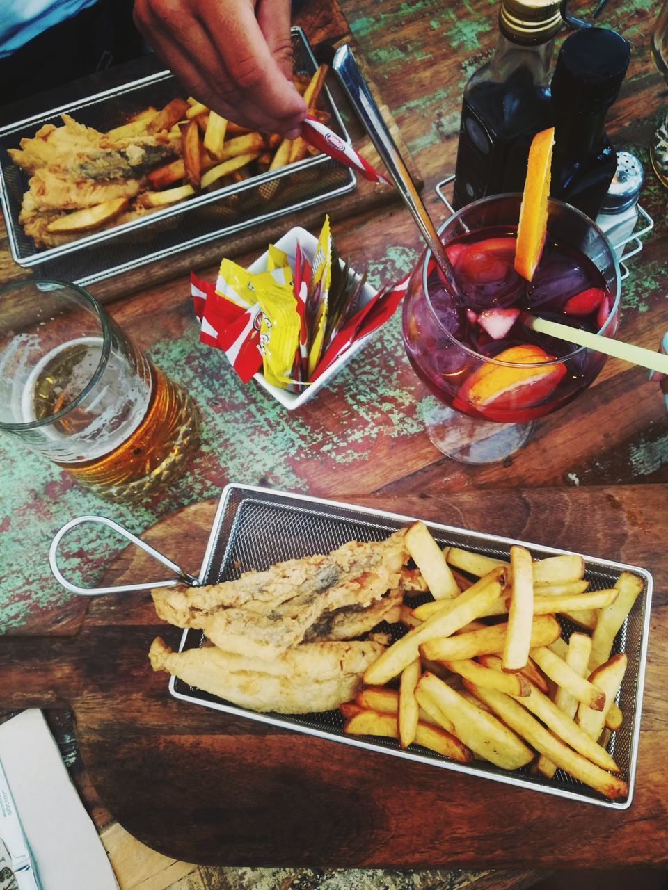 HIGH ANGLE VIEW OF PERSON HAVING FOOD ON TABLE