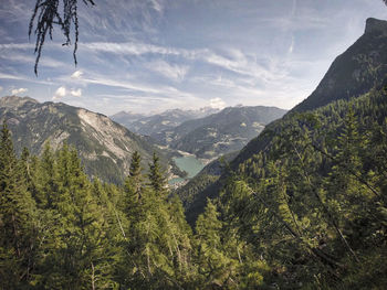 Scenic view of mountains against cloudy sky